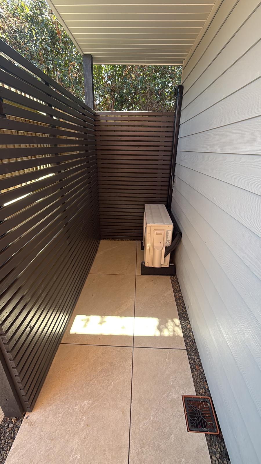 Condenser unit installed in a clean screened area
