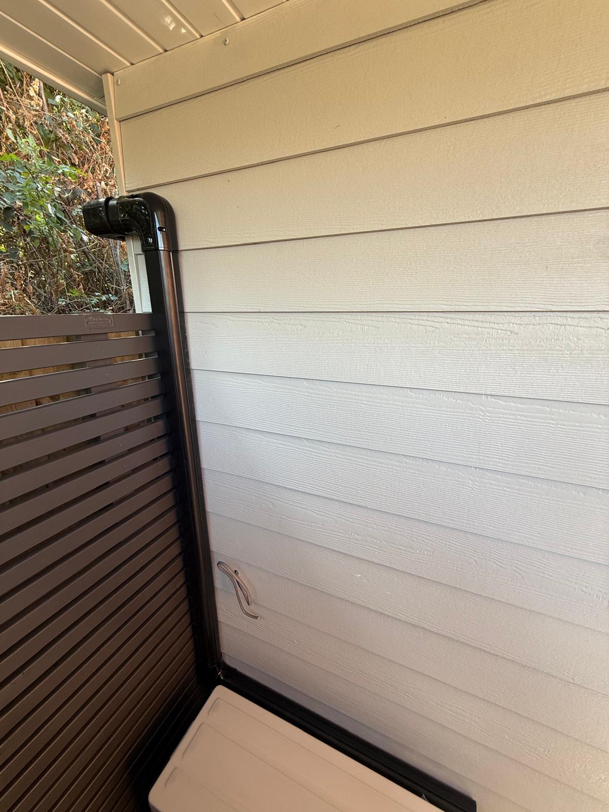 Neatly installed refrigeration pipework on an exterior wall