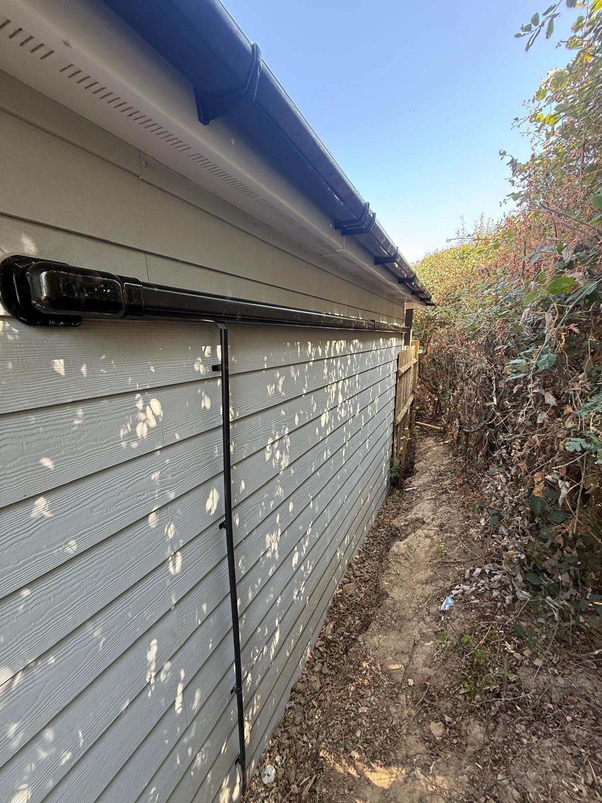 External pipework run neatly along a property wall